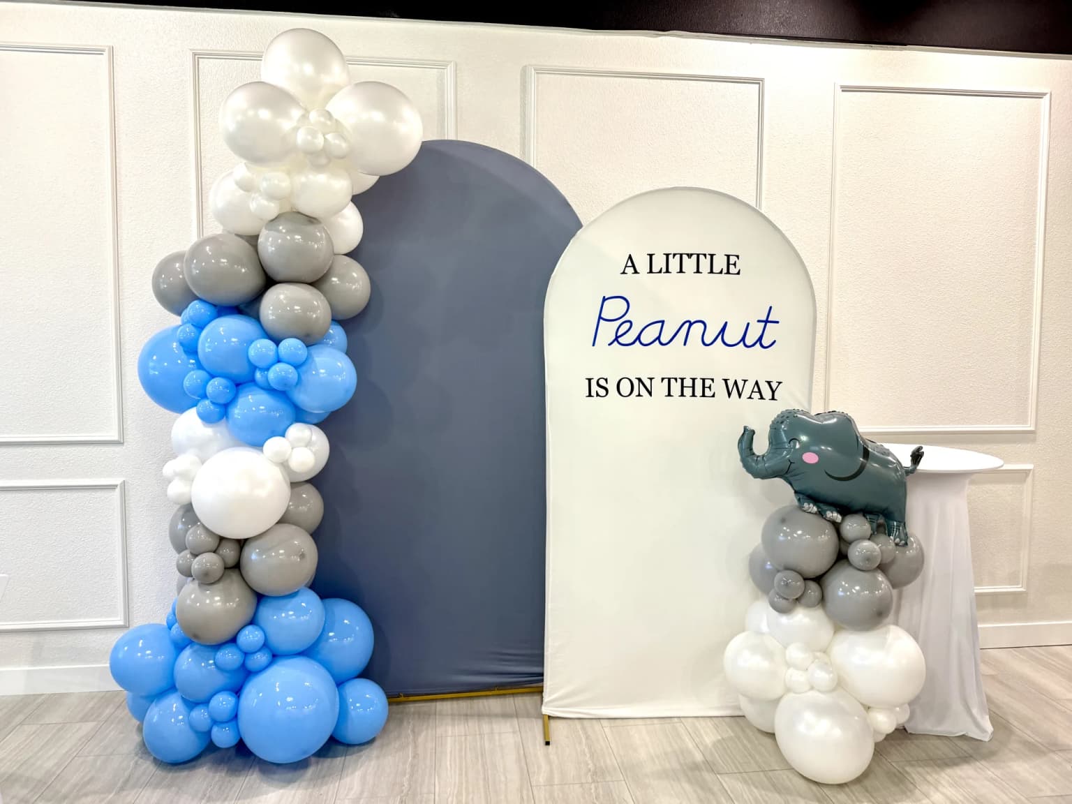 Little peanut baby shower backdrop with blue and gray balloon decor at Aramas Events