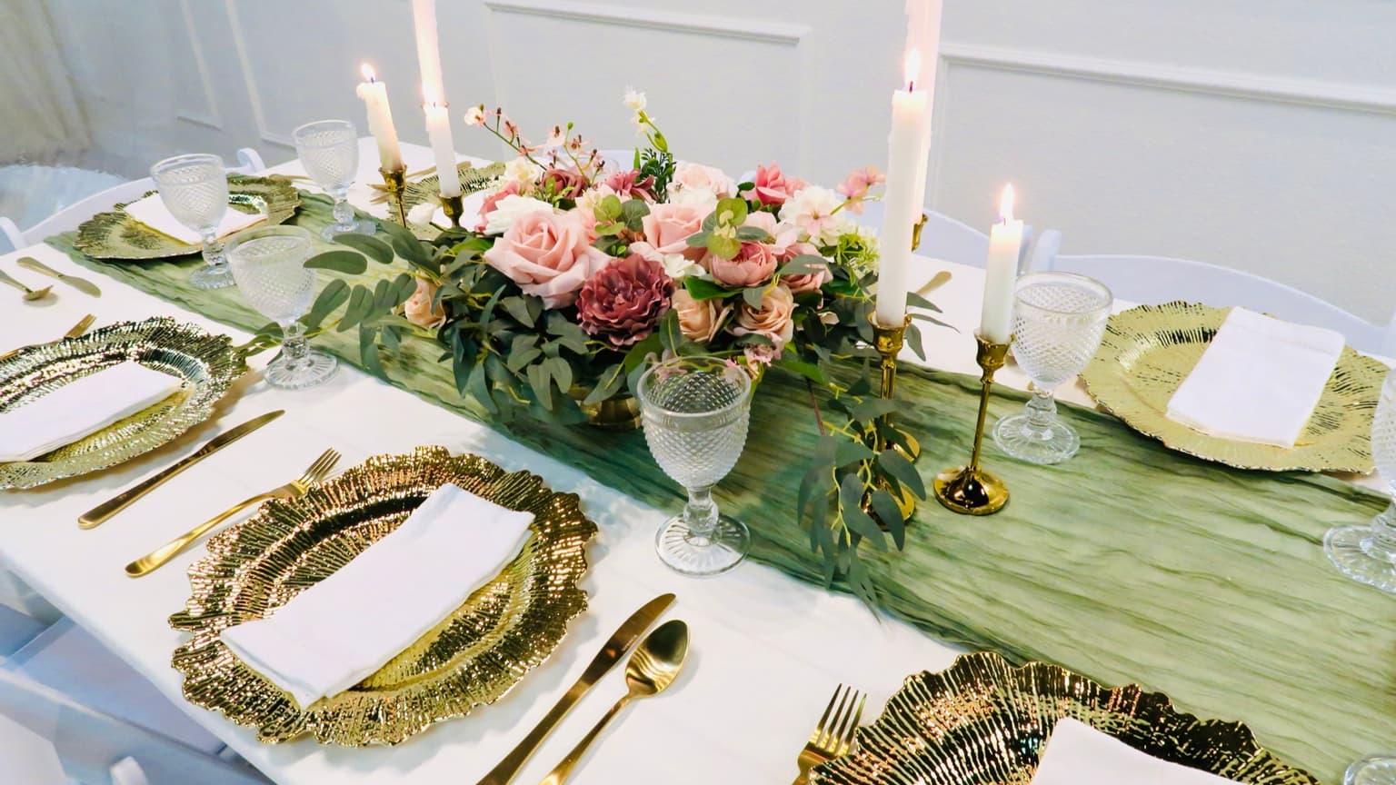 Anniversary party table setup with candles and floral decor at Aramas Events