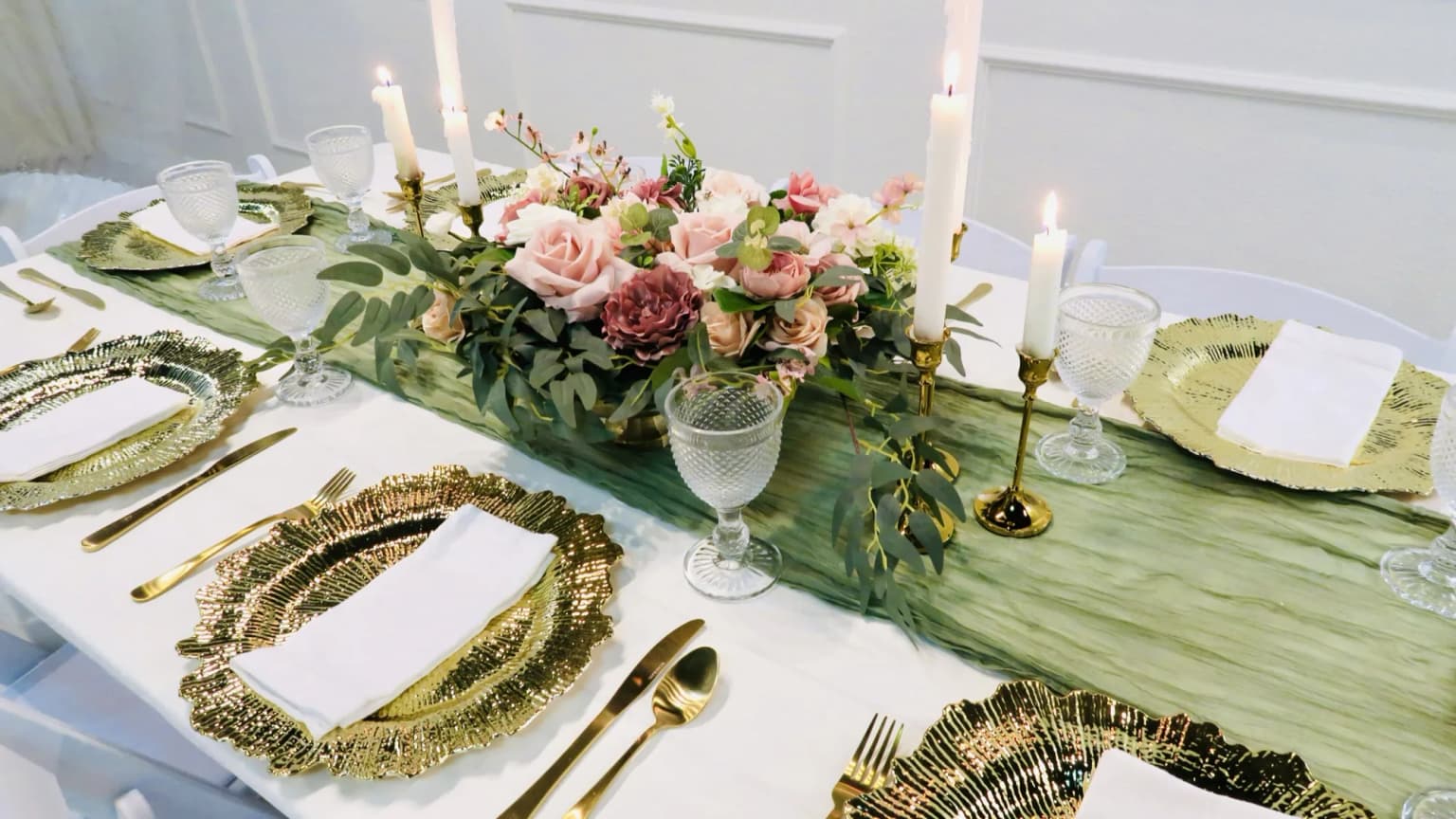 Anniversary party table setup with candles and floral decor at Aramas Events