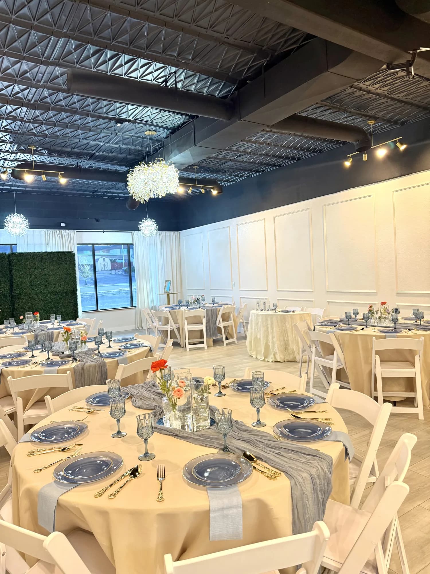 Elopement and micro wedding reception tables with dusty blue place settings at Aramas Events Colorado Springs