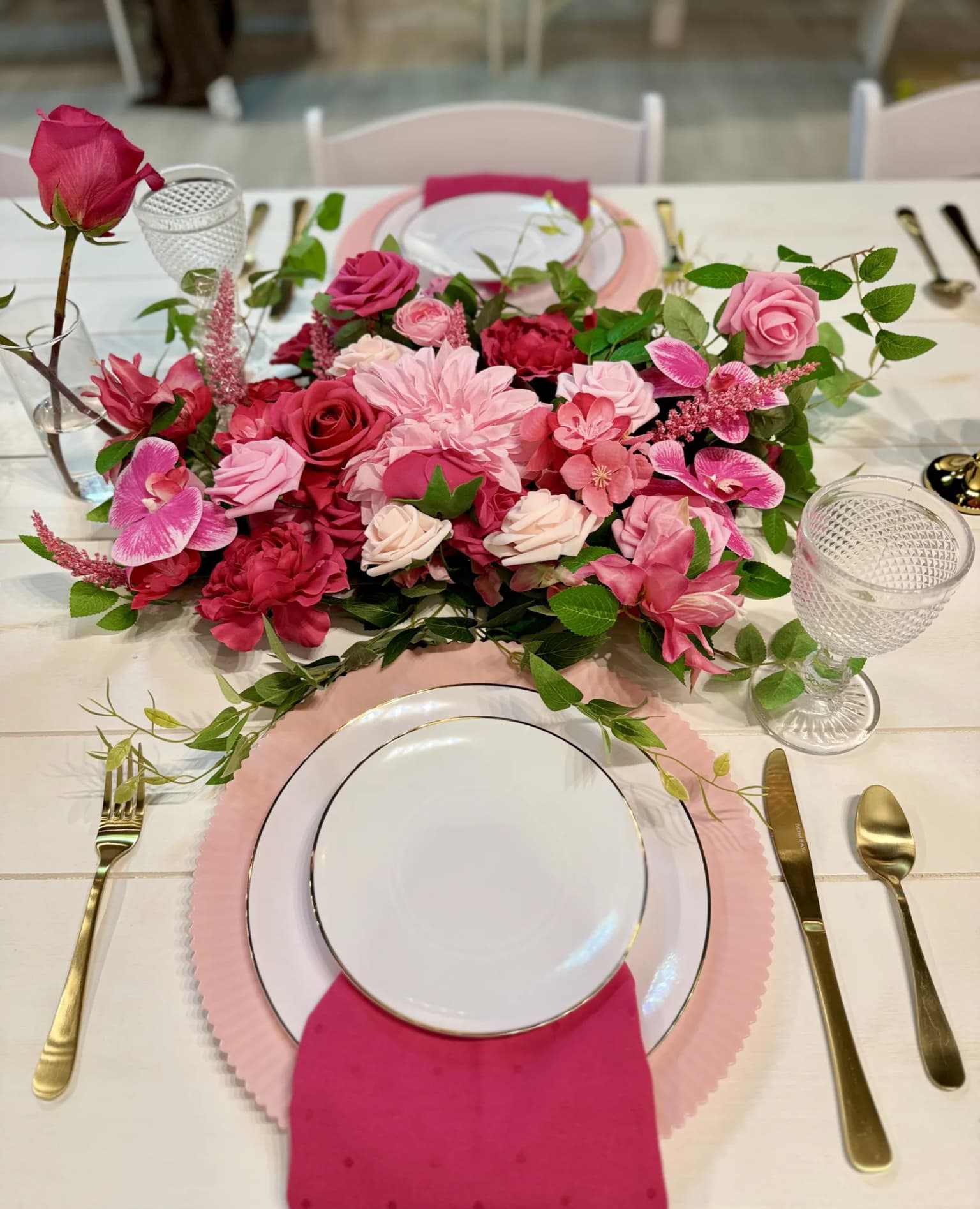 Pink floral place setting and table detail at Aramas Events